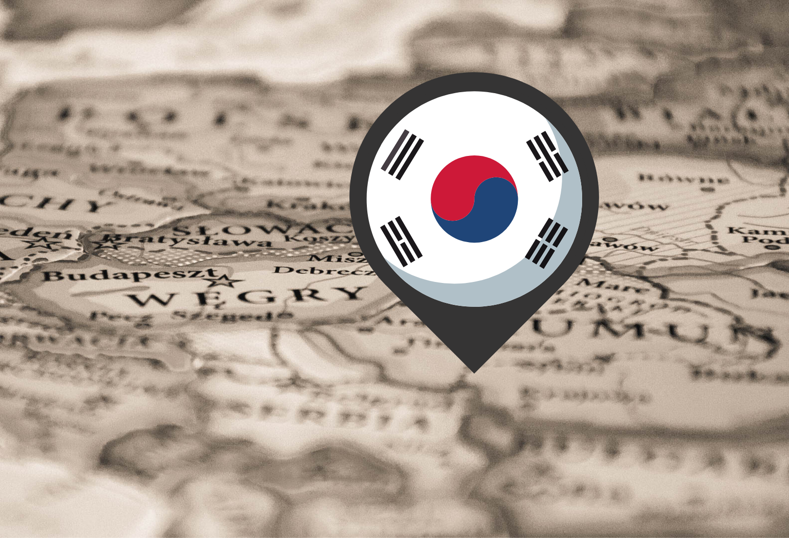 Pinezka z flagą Korei Południowej wbita w mapę Rumunii