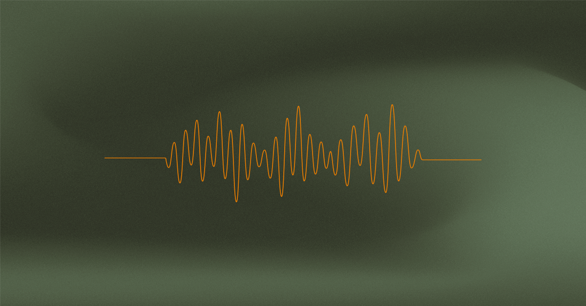 na ciemnozielonym tle pomarańczowe nagranie częstotliwości dźwięku