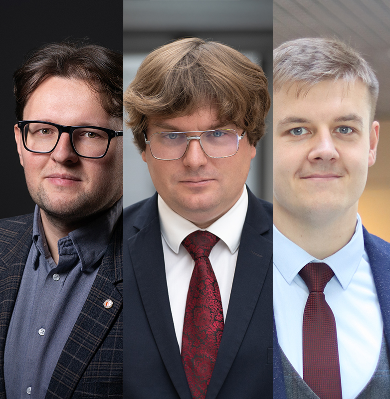 Trzech mężczyzn w garniturach.