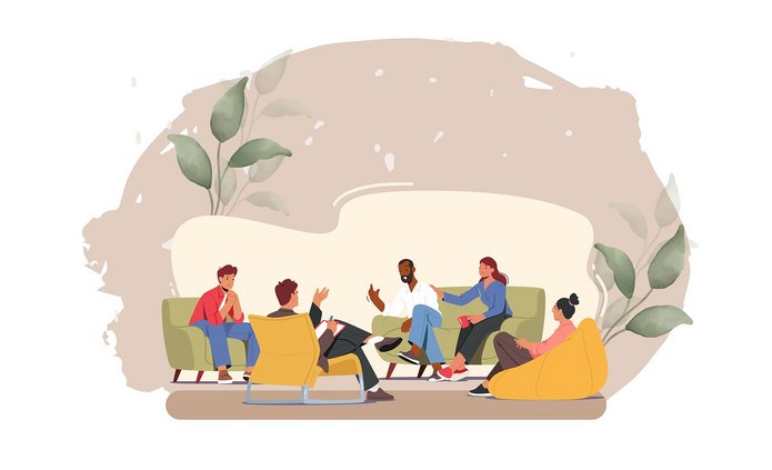 Rysunek przedstawia grupę pięciu osób siedzących w kręgu i prowadzących rozmowę w przyjaznej, swobodnej atmosferze. Postacie siedzą na różnych rodzajach siedzisk – fotelach, pufach i krzesłach, co podkreśla luźny charakter spotkania. Wszyscy wydają się zaangażowani w dyskusję – jedna osoba gestykuluje, inna słucha z uwagą, ktoś trzyma notatnik.