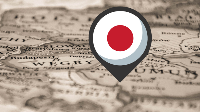 Pinezka z flagą Japonii wbita w mapę/A pushpin with the flag of Japan stuck in the map