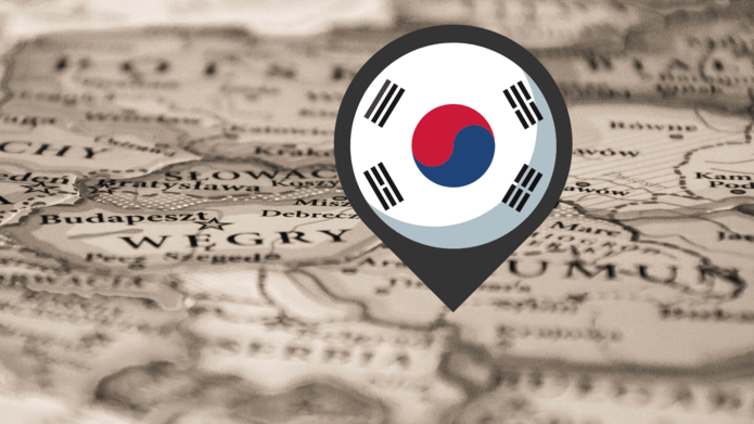 Pinezka z flagą Korei Południowej wbita w mapę Rumunii
