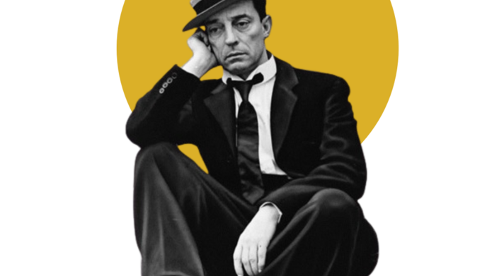 Aktor Buster Keaton w garniturze i kapeluszu. Zdjęcie poglądowe.